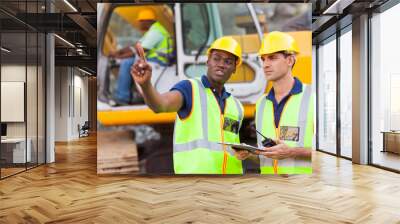 co-workers talking at construction site Wall mural