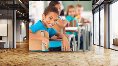 elementary school boy in classroom looking Wall mural