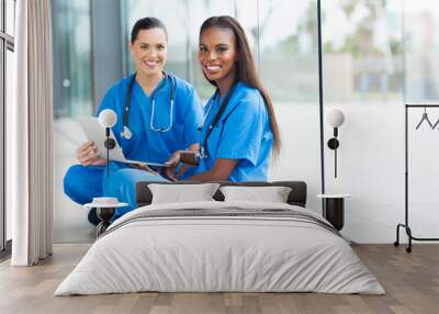 female doctors sitting on the floor Wall mural