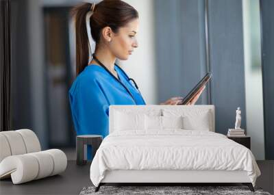 female nurse using tablet computer in hospital Wall mural