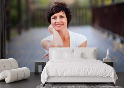 fit middle aged woman portrait outdoors Wall mural