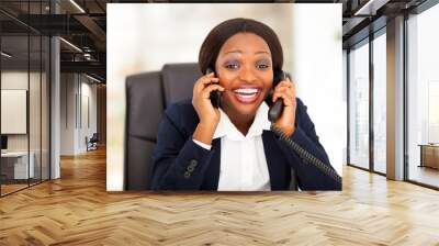 funny african american businesswoman talking on two phones Wall mural