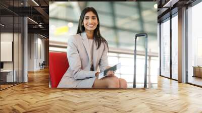 indian business woman waiting at airport Wall mural