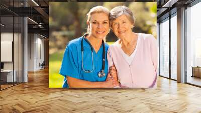 medical nurse and senior patient outdoors Wall mural