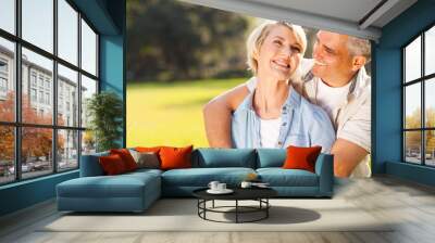 middle aged couple embracing outdoors Wall mural