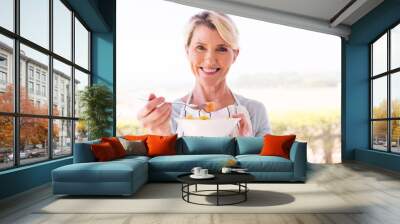 middle aged woman eating salad Wall mural