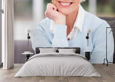 middle aged woman sitting at home Wall mural