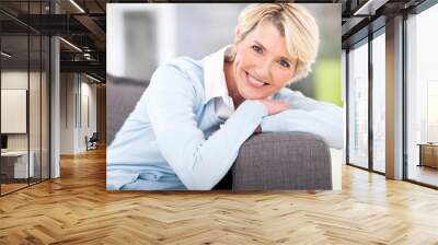 pretty senior woman relaxing on a couch Wall mural