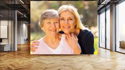 senior woman and middle aged daughter Wall mural