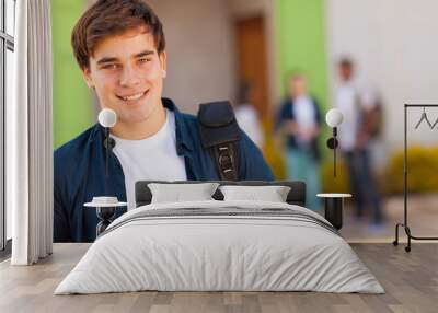 teen boy carrying schoolbag Wall mural