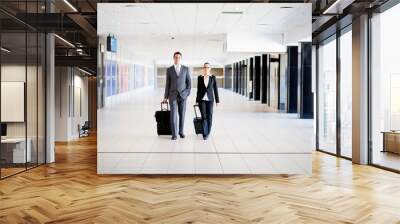 two business travellers walking in airport Wall mural