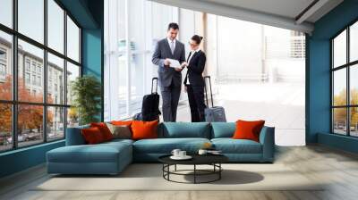 two businesspeople meeting at airport Wall mural