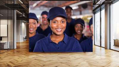 young african factory worker with colleagues Wall mural