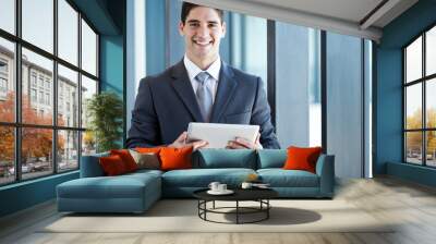 young businessman with tablet computer in office Wall mural