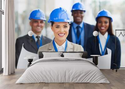 young construction manager holding blue print Wall mural