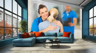 young medical doctor hugging patient Wall mural