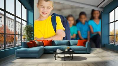 young primary schoolboy with arms crossed Wall mural