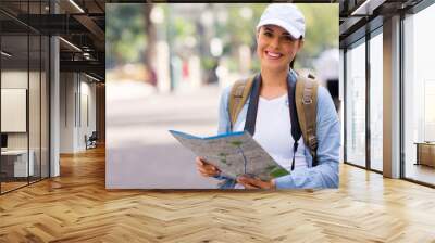 young tourist holding a map Wall mural