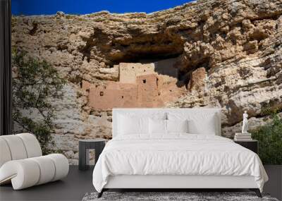 Montezuma Castle old rock dwellings up a sheer limestone cliff. Ancient well preserved Native American cliff dwelling in side of mountain Wall mural