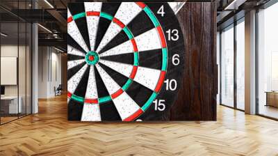 Dartboard isolated on a wooden background. Copy space. Money.Darts game.Business concept.Successful game.National English game. Target on a wooden background. Vertical orientation. Wall mural