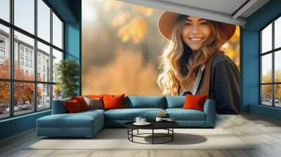 Beautiful woman photographer against autumn background. copy space for text. Wall mural