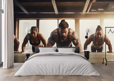 Group of men and women doing workouts in fitnes center. wide banner Wall mural