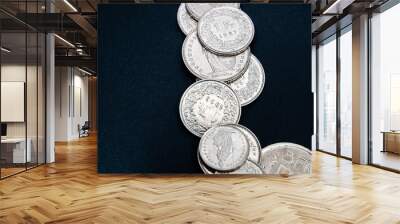 Multiple 1/2, 1, 2, 5 swiss coins franc, centimes CHF money isolated on dark background. Wall mural