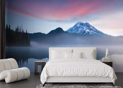 South Sister and Broken Top reflect over the calm waters of Sparks Lake at sunrise in the Cascades Range in Central Oregon, USA in an early morning light. Morning mist rises from lake into trees.  Wall mural