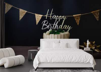 A gold banner with a happy birthday message decorates the birthday cake Wall mural