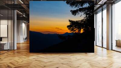 A mountain range during the colorful sunset Wall mural