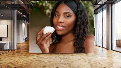 beautiful woman eating mozzarella from Campania in close-up, good and tasty mozzarella Wall mural