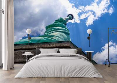 close bottom up view of Statue of Liberty in America on a hot summer day Wall mural