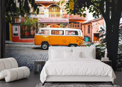 orange westfalia kombi combi parked in tropical beautiful summer paradise for van lifers  Wall mural