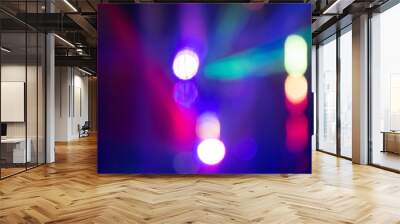 Abstract background with defocused bokeh colorful lights, glowing sparkling lights and reflections Wall mural