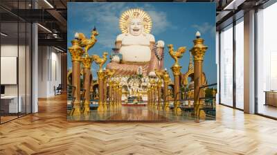 Wat Plai Laem Temple buddhist in Koh Samui Island Thailand tilt up of big buddha sculpture landmark Wall mural