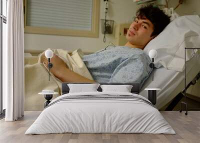 young man at the hospital on hospital bed Wall mural