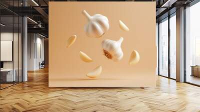 A captivating image of whole garlic bulbs and individual cloves suspended in mid-air against a soft beige backdrop. This image symbolizes freshness, purity, culinary creativity, and the essence of nat Wall mural