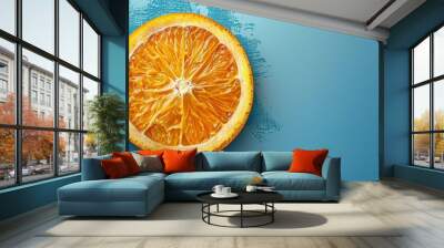 Vibrant of a Fresh Orange Slice on a Sky Blue Background Wall mural