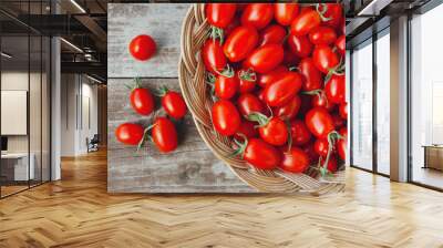 Organic red cherry tomatoes on a wooden board Wall mural