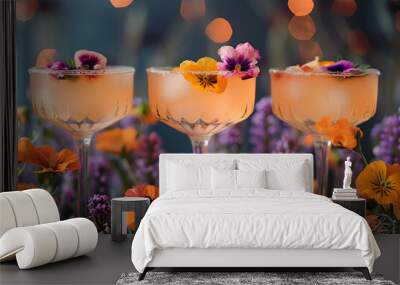 Three elegant glasses adorned with colorful flowers. Wall mural