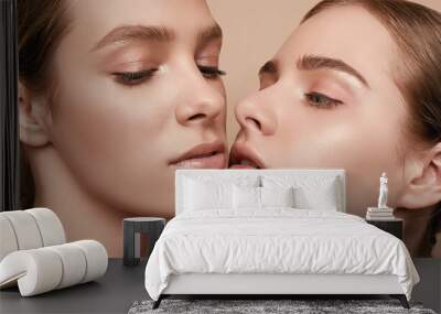 two beautiful sensual young girls with clear fresh young face skin Wall mural