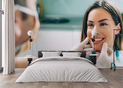 Dentist with beautiful female patient Wall mural