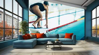 Freestyle swimming race start, swimmer on the starting block Wall mural