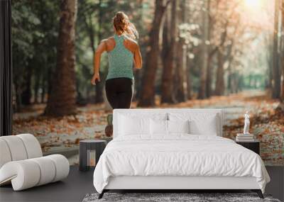 Woman Jogging Outdoors in The Fall Wall mural