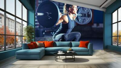 Woman weightlifting on training Wall mural