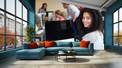 Female College Student Using Computer In Classroom Wall mural