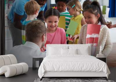 Group Of Children Carrying Out Experiment In Science Class Wall mural