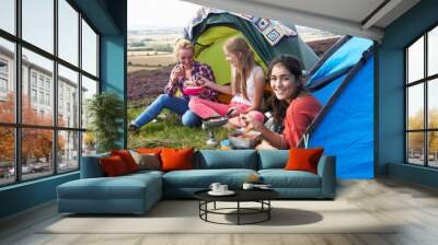 Group Of Teenage Girls On Camping Trip In Countryside Wall mural