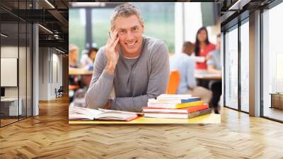 Male Mature Student Studying In Classroom With Books Wall mural