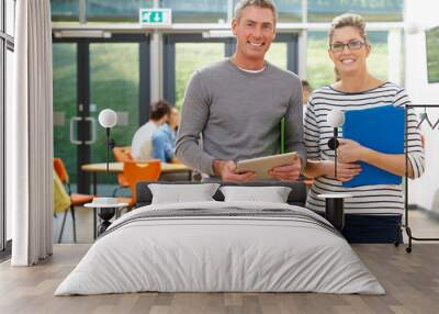 Portrait Of Male And Female Tutors In Classroom Wall mural